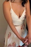 I love this wraparound dress! It's beautiful and I received so many compliments. I used this to celebrate my original wedding date. The dress runs a bit to long even with heels and the button on the dress kept popping open. Even so, I love this dress and can't wait to wear it out for my bridal party in September. - Roselyne R.