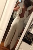 I bought this piece for my bridal shower coming up and I am so excited to wear this jumper!! Paired with some bright colored accessories and it will look just right. I have a bigger butt and the material is stretchy enough to wear actual sizes. - Whitney G.