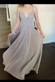 This dress is gorgeous! The color is a little darker in person, so doesn't look too white if your going to a wedding. Flow is nice. Also lined inside by a very soft material. Could dance all night! - JT V.