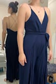 I love this jumpsuit! The only downfall for me is that since I have a long torso, the area was too short so it dragged the fabric downwards and gave me a very noticeable front and back wedgie. Going to order an XL if the length makes a difference and then alter it if needed. The material looks very formal and seems simple to iron. LOVEEEE The slits and the back details. I have small breasts but I am broad at the shoulders so some fabric tape would be perfect for extra security. Personally I wouldn't need a bra. - Samantha D.