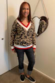This sweater fits true to size. The material is really soft. It's not a heavy sweater. I love how it looks on me. I paired it with some black jeans and a pair of the black Lulus sneakers. I wore it to work and so many of my co-workers loved it and they wanted to know where I bought it. - Jannie M.