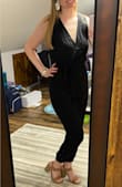 I am one of the taller girls who has a difficult time finding rompers or pant suits that fit due to length reasons and this outfit length fit well! The chest actually is a little loose (I typically am wear 34B size bra) on me and I may benefit from using dress tape or a safety pin to make sure it stays secure but not so loose I don't think I could wear it.... in fact, the top part seems a little snug as I'm putting the pant suit on and getting my arms/shoulders in... I almost wish it had a zipper or tie on the back so it would be easier to get on/off and then fit better in the chest if that makes sense. The pants stop slightly higher than my ankle and I think the look is cute with heels, wedges, etc! Overall a little fit issue but still super happy with it & can't wear to wear it (after a good steam)! :) - Shelby B.