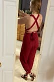 I'm one of those taller girls who has a hard time with rompers/pant suits fitting due to length and such but this fit! I actually found it a little loose but I think this is meant to be more of a flowy look anyway. What's awesome about this is the super long straps up top so you can adjust the fit very easily based on how your wrap & tie it! The back is so cute & fun! I have a smaller chest and I wanted a more risky outfit without being overly so and it works ! Can't wait to play around with how to style it & wear it (after a good steam)! :) - Shelby B.