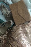 A rose gold sequin off the shoulder top and these champagne with flecks of rose gold throughout that matched this clutch to perfection, paired with white jeans. This was what I wore to a family dinner at a restaurant.. - Francine E.