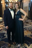 This dress is absolutely beautiful! I wore it to my law school ball and got so many compliments. The slit is high but there is a lot of dress fabric so it doesn't show as it does on the model (which I was happy about). The color is so beautiful and looks just like it does in the picture! - Jenna S.