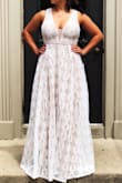 I bought this dress for my outdoor, summer wedding. I wanted something laid back and light-weight so I didn't get too hot! It was perfect and I got TONS of compliments. I was barefoot for the wedding, I'm 5'2", and I had to have it hemmed quite a bit! Only thing I would have changed is how much cleavage it showed, I'm a 36DD so take this into account if you are busty like me! It's pretty revealing in that area. Overall, totally worth the money, I loved this dress so much. - Bri C.