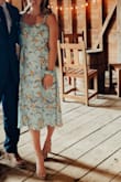 Dress is a great color and print however the tie in the back of the dress offers very little chest support and I found that although I'm usually a true medium I was unable to tie the chest as tight as I would have liked. Wore the dress to a wedding and it was fine. - Chelsea C.