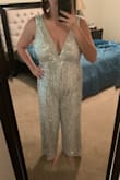 Loved the jumpsuit but I'm gonna have to return. The material was great and the length was perfect (I'm 5'8"). It also fit very my larger chest very well (I'm a 36DDD). The only issue is that the jumpsuit barely gives any room for a torso - it pulls up in the middle and is unflattering for the crotch area. It makes it look like it doesn't fit well in the front, but is unnoticeable in the back. It would work for someone with a shorter torso but everything else fit perfectly. I wish it worked. - Madelyn D.