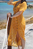 Wore this last summer on my cruise. I love the color and how flow-y it is. It is a little tight in the waist area for me. I stitched the top of the bust area so it wouldn't flop around. - Stephanie L.