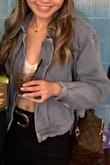 Material is thinner than expected (it's not regular denim) but I think if it was any thicker it would definitely not be as flattering. This jacket is so cute and versatile, fits true to size! - Kim T.