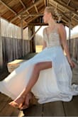 This dress is beautiful!  Everything about it is perfect!  The fabric is soft and flowing, the lace up back gives it as snug or loose of a fit as you want, the beading on the bust is just enough without making it too heavy and the leg slit is cut just-right.  You won't be disappointed with this dress! - ANDREA M.