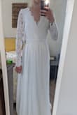 This dress is absolutely stunning on! I ordered it for my intimate wedding ceremony and I love it! I did order it in an XS, and the top was a little loose, so I reordered it in an XXS and it fit a lot better. The dress itself was really long on me, so I had to get it altered. But other than that, the dress is perfect! - Breanna Z.
