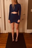 This is a fun and different dress. It's pretty short, which I don't mind, but some might. I love the color and the cut. The material is a tiny bit baggy just below the cutout and I would love for it to be tight against the skin, but it's super comfortable, so there's that! - Carey J.