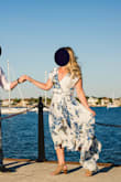 I bought this dress in a medium and small for my engagement photos. I usually wear a medium in Lulus dresses, but the medium was too long on me, so I went with the small which actually fit perfect except for having to safety pin the bust area closed. Our photographer loved how great it photographed and it was so flowy. I love how it was shorter in the front so I wasn't tripping over it. - Lauren R.