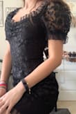 Super cute dress - the detailing, length, and fit are perfect. I agree with other reviews that it is a bit scratchy (especially around the sleeves) but nothing too bad. The neckline is beautiful and looks just like the picture. Overall would recommend! - Ana C.