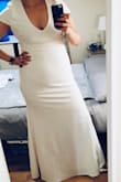 The dress is pretty! The fabric is good but it wrinkles easily. 
I didn't like the sleeves much as they are shorter than I expected. I'll modify the sleeves and it'll be perfect. - Ale H.