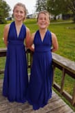 I got this dress for the three preteen-teens to be in our wedding. It is navy in color but in photos it shows up lighter blue (almost royal blue). The girls all loved the dress because they can wear it again and in multiple ways. - Jessica G.