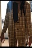 It fits nicely however, the sleeves are short on me. I am a tall girl, so I do plan on getting it altered because I love it so much. It comes with a belt like thing, but plan on using it on the pants instead. - Madison D.