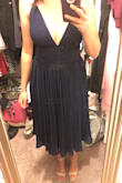 Fits perfectly! It is a bit low cut but still classy. - Alexandria D.