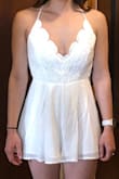 I love this romper, but the top is made very, very loose. In the pictures, I have the straps tightened until they're uncomfortable, but I will still fall out of this if I lean forward. You can see EVERYTHING if you look down the front. I am not super small-chested, but it's so loose. Fashion tape makes it wearable, but I wish the fit was just a little better. I am not returning it regardless, because it's so cute and I love the bottom fit and length. - Rachel M.