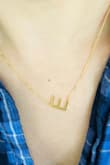 I bought this letter necklace because my kids names start with an E. It's really simple and matches well with many outfits. - Danielle Y.