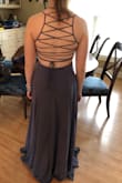 This dress is a gorgeous color and the strings in the back are very easy to tighten and loosen with another persons help. I love it so much!! - Rylie D.