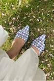 Love this shoe! Blue gingham print is so cute for spring/summer outfits. They are very comfortable, as the heel is low and the shoes aren't painful as some pointy toe shoes can be. I recommended sizing up. I wear a 41 and my heel just hits the back of the shoe. I could have gone half a size up but it's still a comfortable fit. - Rima S.