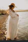 This dress came out so beautiful in our maternity pictures. It was a little large, I should have ordered a small but it did just fine, and was very comfortable. - Diana M.