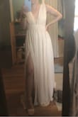 I bought this to wear as a bridesmaid dress. The color is perfect and the fit is almost great. Some slight alterations, such as getting the shoulders and bottom taken up, will have to be made, but I am shorter (5'3") so that is to be expected. Around the rib cage area was also a little large on me so I'll have to take it in. I love the high slit, a lot of leg but not too much. Once I get it fitted it will be perfect. - Claudia R.