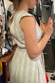 I loved the dress at first - fabric, color, just as expected. Fit perfect. I usually wear a Small in Junior or size 0. The belt is removable which is nice for layering. 
However, the neckline is too low for me, bending over would definitely expose some bra/cleavage, especially for those with smaller chest. Also the closure with the slit gaps in a weird way. These two things make it uncomfortable for me to wear this dress, I'd have to be constantly yanking and pulling. I was hoping the dress would work! - Anna U.