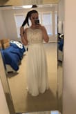 I ordered three dresses to try on at home for my elopement next month. This dress is much more flattering on than it is pictured online. It is much more nude under the lace than pictured online, but SO pretty. I am used to dresses meant to be floor length being way too short on me and I can say that definitely is not the case and if I was keeping it, I probably would've hemmed a little bit. Four starts bc it wasn't the winner. - Shelley C.