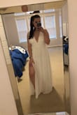 Ordered this dress as one of the three I am going to get married in next month. Very pretty but a little loose in the bust. As you can see in the photos, the fabric is a little loose and billowy by the breast. Thick enough not to need a bra or anything which is great. Great length for us giraffes and I loved the deep V on the back. If this was the winner, I would've hemmed it a little bit and gone to a seamstress to adjust the fit of the bust. Great quality, there are several layers in the skirt. Four stars for the fit, but definitely could've made it work. Such an affordable option! - Shelley C.