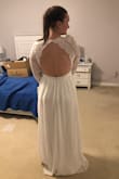 Ordered this dress as one of three I wanted to try on at home for my elopement next month. This one is for sure my winner! It is just absolutely beautiful. I am posting pictures of it as is. I am going to get it altered, but you can't beat the price. I love all the details, I am going to see if I can get the V a little deeper and maybe cap or do 3/4 sleeves. The sleeves are loose, so if I keep the sleeves, I will at least make them very tight to my arms. I LOVE this dress, it looks so much better on once you try it on than it does in the photos. Also, it is VERY long, I am 5'10" and will likely take off several inches. THE BACK is just TO DIE FOR. I have the sleeves shoved up my arms in the picture I am posting bc I think I want to shorten them to 3/4. If I wasn't planning on getting it altered, I would honestly be contemplating a medium rather than keeping the large. - Shelley C.