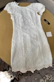 The dress was nice.  I'm 5'9 and needed the medium for the length but the sides and open back were too loose. - Gina H.