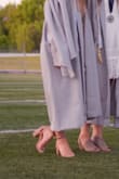 The toe strap at the front of the shoe is a little tight, but not a big deal. I also had to wrap the ankle straps really tight or else my heel would pop out when I walked. I got lots of compliments on them and will definitely wear them all the time! - Madeline V.