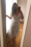 I love love this dress! It's so beautiful. I showed my mom and she thought it was a 200 dollar dress. My only complaint is it is a little tight on my upper back and if I went a size up... it would fit my body right. But otherwise... perfect! - Caroline S.