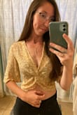 This shirt is super cute. However, it is a little flimsy than what I would expect for this brand and price. The best part is that you can wear a normal nude bra with it. I like it enough to not return it! If you don't like showing your belly button (like me) you'll need super high waisted bottoms. - Francine W.