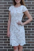 This dress fit perfectly. It hugs your curves but doesn't hug tightly. The length does reach my knees but I felt professional and it was comfortable to wear sitting down. Definitely recommend this dress! - Jeanette G.