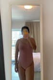 Lovely color and fits perfectly in my petite size.I can't wait to wear in pool or beach. - JCIL D.