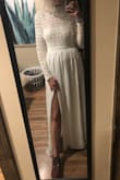 I ordered this dress and a different one to decide on a later day which one to wear for my elopement. I wanted a long sleeve dress and a short sleeve one to choose from because you never know the weather in April. I would have worn this in a heartbeat if my elopement fell on a cold day, but it was hot! So ended up wearing the "sweet stunner 2 piece". 

This dress is true to size. The length was not a problem for me as I'm tall. So short people might need to alter this. The only concern is I wouldn't be able to wear a bra with this. The back of the dress didn't allow you to wear one as you would be able to see the back of the bra. You would also be able to see the bra from the front of the dress. The front panel that goes across your chest sits lower than a bra would.  You would need to use tape or other alternatives if you're not comfortable enough to not wear a bra. The slit was at a good length for me (mid-thigh). Overall it's beautiful, boho, comfortable, and unique looking. It's modest but not frumpy. - Jena T.