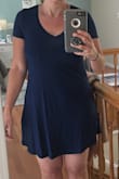 Easy and fun dress - can throw on and go.  It is a little shorter on the sides, but longer in the front and back so it covers everything it needs to.  Love the deep rich blue color and the soft feel. - Alyssa A.