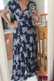 This gauzy material fits well- loose fit but still shows you have a figure. The material is lightweight and easy to wear. The style is fun and flirty. Can wear with flip flops or heels. - Alyssa A.