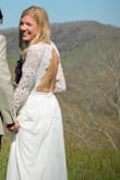 This dress was absolutely beautiful! I wore it for our small wedding ceremony, as our original wedding plans were disrupted by the pandemic. Fits true to size! The sleeves were a little itchy, but I was able to wear it for several hours and it wasn't too bad! - Emily H.