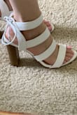 I wanted a white strappy heel for the summer and these are perfect. They're true to size and can be adjusted around the ankle since they tie. They're a little high so I don't think I'll be able to stand a long time in them. I would recommend. - Julie D.