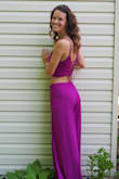This power purple pant suit is a killer. The color pops and is so bright you'll turn heads wherever you go! The leg slits are fantastic for keeping you cool or adding flare to dancing, and the back is my favorite little detail. For someone with a smaller bust, this top has magic skills to make them appear, even without a bra. With a long torso, the gap between the two pieces is somewhat larger, but is a friendly encouragement to work on and show off my abs. - Becky C.