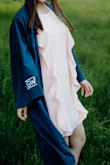 I bought this for my graduation, which unfortunately got canceled. However, I still got some use out of the dress by taking grad pics! It's gorgeous, and complements my skin tone along with my cap and gown. It is a bit of a lighter pink than posted in the picture. - Joan K.