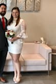 It fit well but was a little short. I dont have long legs and felt like I couldnt bend much. It was nice for my elopement due to Corona. - Justine M.