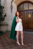 I love this dress. It was perfect for graduation photos. it looks so elegant and classy. It is not poofy at all. It lays flat and it is very flattering to all features. My favorite part about the dress is the cleavage cut. I got so many compliments on the dress and I felt very confident in it. I would definitely recommend this dress to anyone. The dress is very high quality, and the material of the dress is thick so I know it will last me a long time and I can wear it in the future for other events. Also the back straps are very sturdy and supportive. - Shannon L.