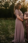 I would usually wear a medium, but being that I'm 34 weeks pregnant, I sized up to a large. I almost didn't even try it on - because I was worried the cut outs would be a little much with being prego. IT WAS PERFECT!! I'm so happy I tried it, I felt so beautiful! I'm pumped to get it altered and wear it again post baby. - Ashley N.
