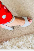 The shoe looks pretty on. It is a little tight around the baby toe and big toe. But it is true to size. - Monica M.